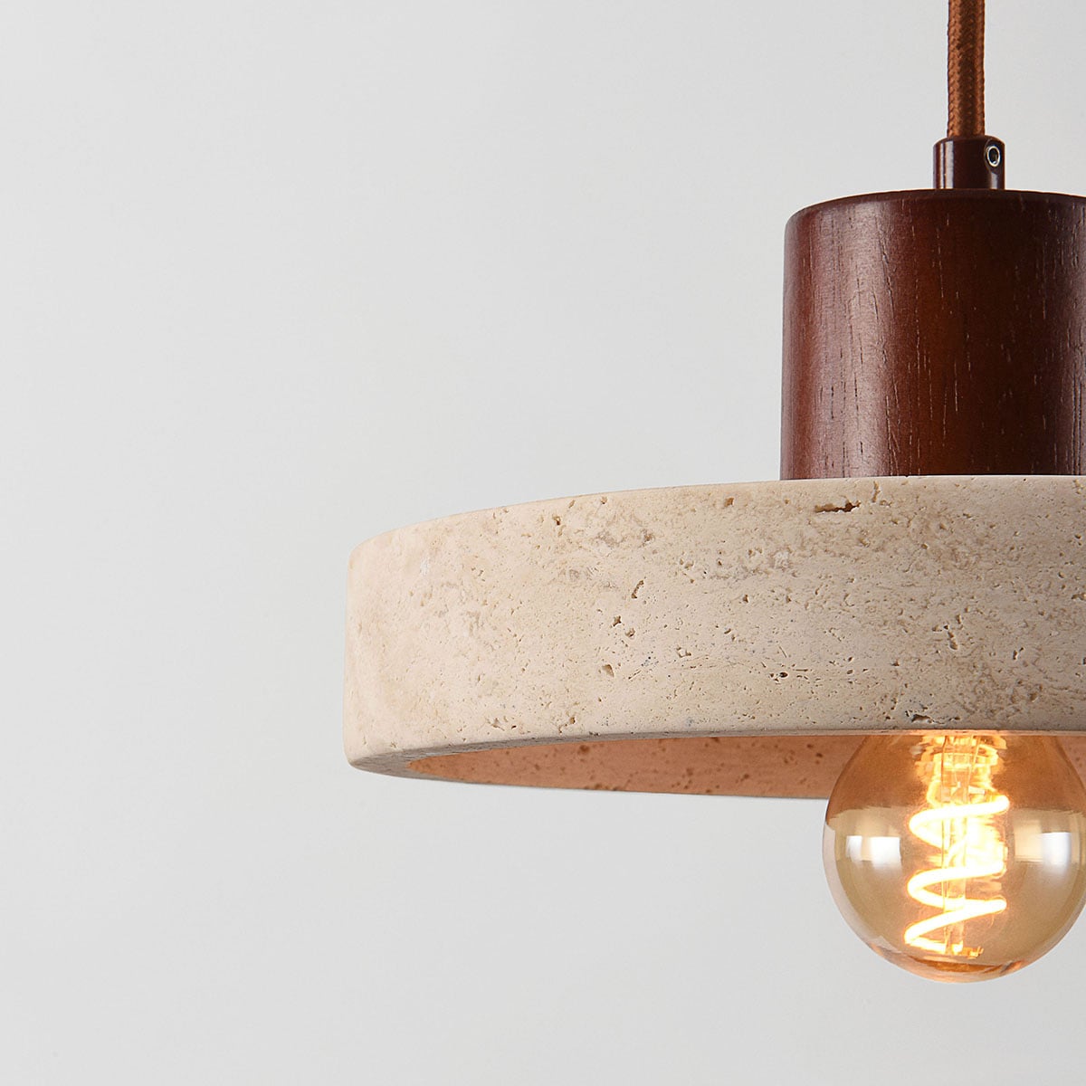 Travertine Pendant Light – natural stone shade, dark wood cap, adjustable cord